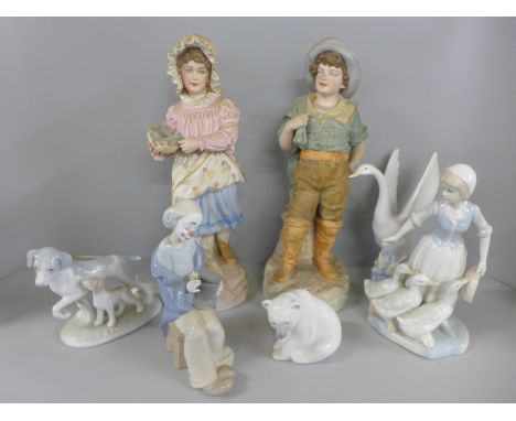 A pair of continental bisque figures, Lladro Polar Bear, Nao clown, etc 