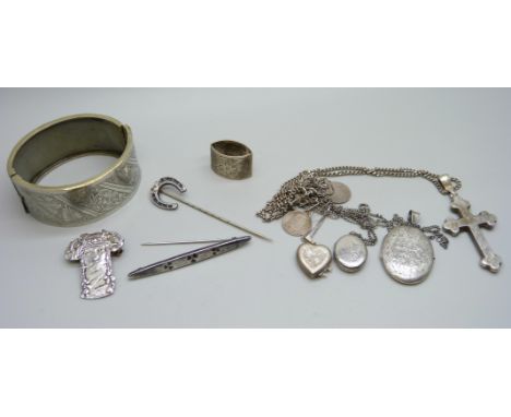 A hallmarked silver shamrock brooch, a bangle, three lockets, a cross pendant, etc. 