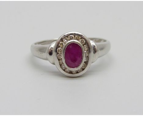 A 9ct white gold, ruby and diamond cluster ring, 2.6g, Q 