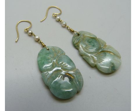 A pair of carved jade and pearl earrings on hallmarked 18ct gold wires, jade 18mm x 30mm 