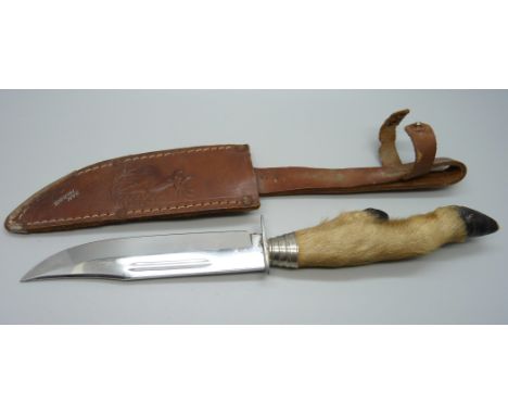 A hunting knife with scabbard, the blade marked Olivetto, the scabbard marked San Marino 