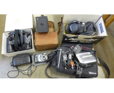 A Nikai PDS System 35mm camera, a Samsung 34X optical 300m camcorder, a pair of Opticron 8x42 binoculars and three other came