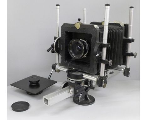 A Professional Studio Monorail Analogue Plate camera 4 x 5 with two interchangeable lenses, one marked Super-Angulon 1:8/90 S