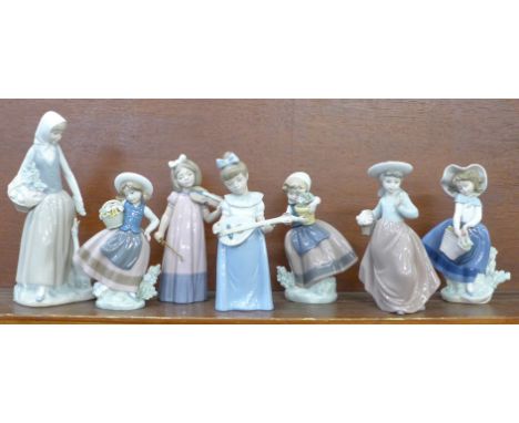 Three Lladro figures and four Nao figures, two a/f 