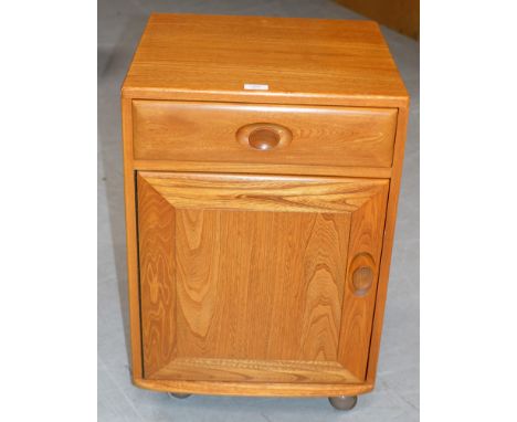 AN 18¼" ERCOL LIGHT OAK CABINET WITH SINGLE DRAWER    