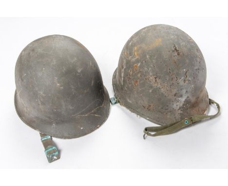 2 Korean War period US Army steel helmets, complete with linings and chin straps. £40-60 