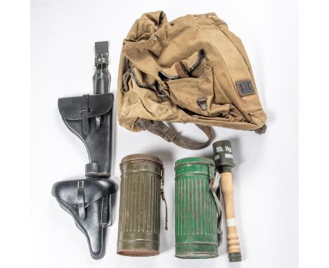 A Third Reich Mountain Troops rucksack, 2 respirator canisters; 2 post war black leather Luger holsters; a bayonet frog and a