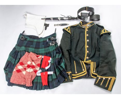 A Highland piper's uniform, comprising full size dirk, dress imitation skean dhu, gilt laced green doublet with Argyll &amp; 