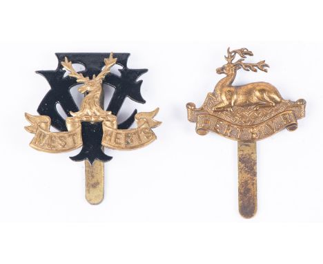 Two WWI cap badges, of the Hertfordshire Vol Regt, and the West Hertfordshire VTC (K&amp;K 1627 and 1628). GC (2)  £50-60 