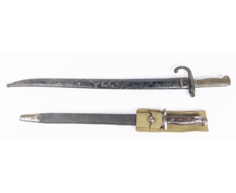 A Chassepot bayonet dated 1874, in its scabbard (blade well pitted); a 1907 bayonet (scabbard well worn). GC (2) £70-80 