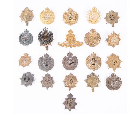Eleven pre 1919 Army Service Corps cap badges, including QVC, early type officer's bronze, and three WWI non voided; ten Roya