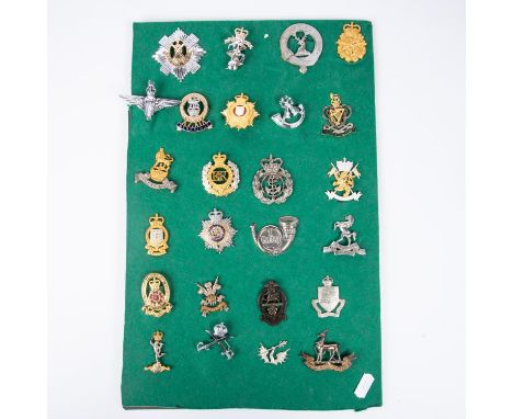 Twenty three various cap badges, including silver coloured Ryl West Kent officers, the Scottish Yeomanry officers, QEII offic