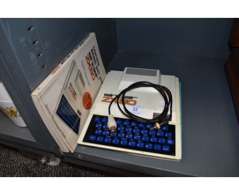 A vintage Sinclair ZX 80 computer with manuals