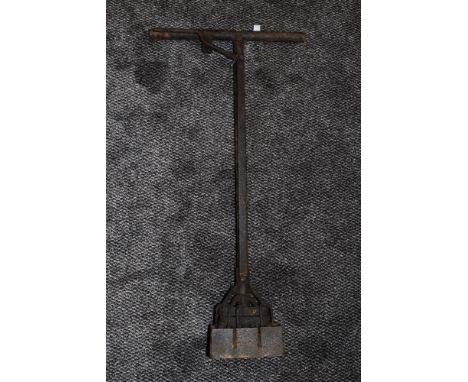 A vintage agricultural tool or similar.