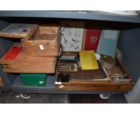 A collection of vintage art supplies and wooden boxes, including paints,pastels and sketch books with some sketches and water