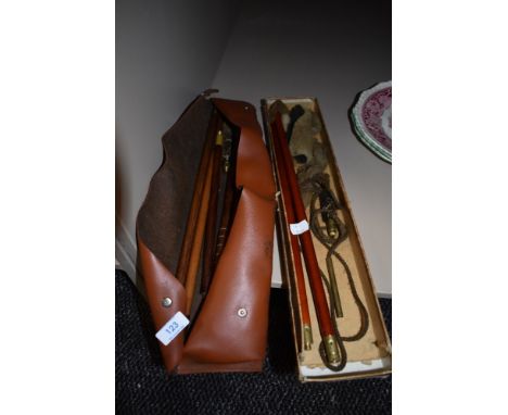 A selection of vintage gun cleaning rods and equipment.