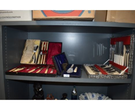 A selection of vintage canteens of cutlery including fish knifes and forks.