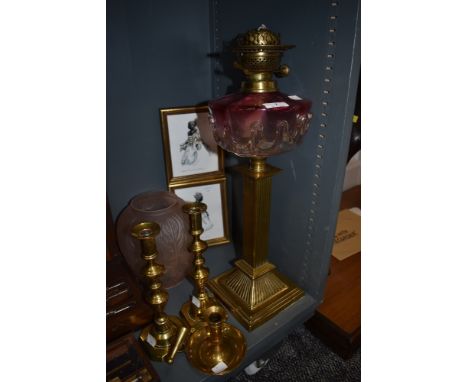 An impressive Victorian oil lamp having hand blown well with graduated cranberry glass also similar candle sticks and pink sh