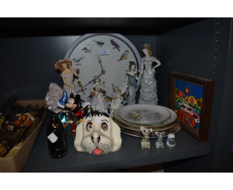 A mixed lot of ceramics including Mickey mouse now globe, Leonardo collection figurines, bird clock, vintage animal figures a