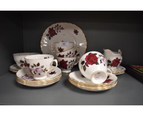 A selection of vintage Colclough bone china having transfer rose pattern including sandwich plate ,cups and saucers and side 