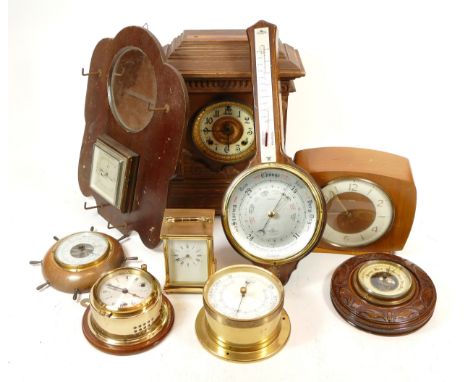 A collection of mid 20th century and later mantel clocks, carriage clocks, barometers and wall clocks, having manual wind and