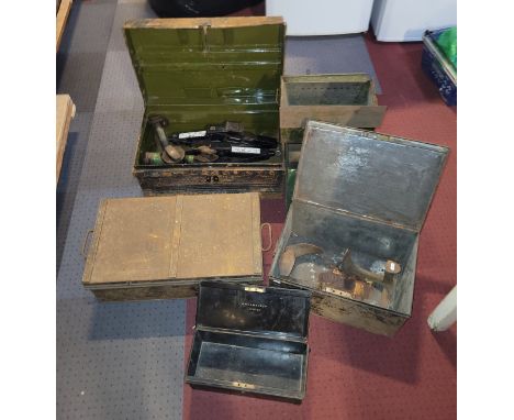 A large collection of metal boxes, to include, a deed box, cash box, tool box, alongside six car jacks and two shoe lasts.