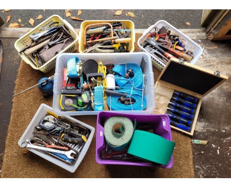 A large collection of assorted hand tools.