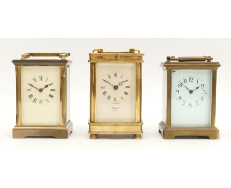 A mid twentieth century British brass carriage clock, with an enamel dial, Roman numerals and an eight day movement, H-12cm, 