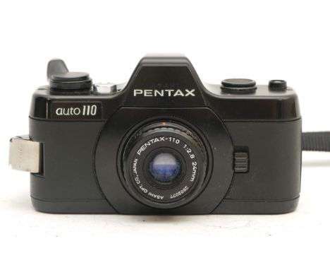 A Pentax Auto 110 film camera with winder and 24mm lens