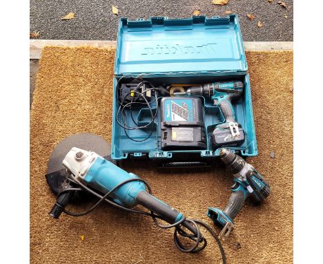 A Makita 18v battery drill (cased) with an extra drill and 240v Makita 230mm angle grinder.