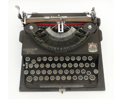 A 1930s Imperial Good Companion portable typewriter, retailed by Reids Typewriter Service, appointed as typewriter manufactur