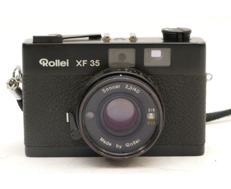 A Rollei XF35 35mm camera, with case and manual