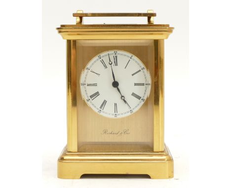A mid twentieth century Richard and Cie brass carriage clock, with an enamel dial and an eight day movement, striking on bell