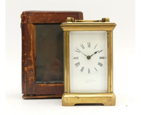 An early twentieth century brass carriage clock, with an enamel dial, Roman numerals and an eight day movement, striking on g