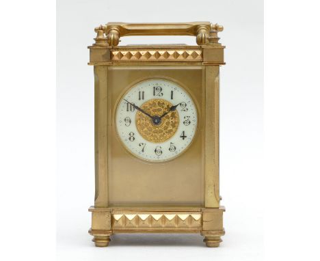 Early 20th century gilt brass carriage clock, having painted porcelain chapter ring with Arabic numerals, housing an 8 day mo