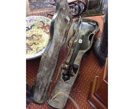 An early 20th century violin in original case with bow.