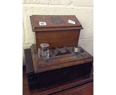 An early 20th century oak stationery box with single glass inkwell together with a mahogany brass bound writing box (no inter