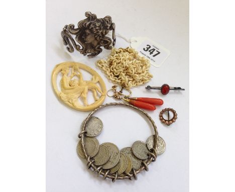 An Art Nouveau white metal bangle in the style of WMF modelled as a long haired young female together with various jewellery 