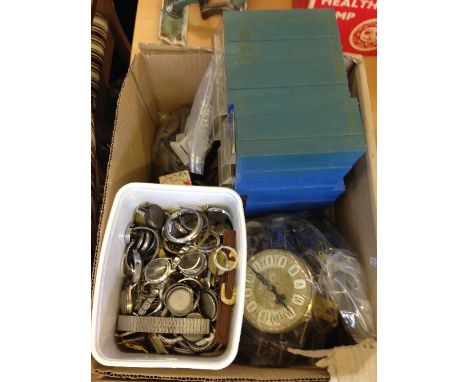 A box containing a large quantity of watch and clock parts.
(R40)