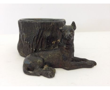 A Spelter toothpick holder modelled as an Alsatian next to a tree trunk.