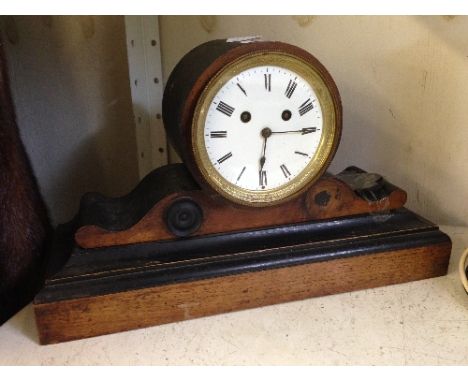 A late 19th century walnut veneer cased mantle clock (examine).