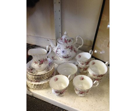 A Royal Albert bone china teaset decorated in the Lavender Rose pattern complete for six with teapot.