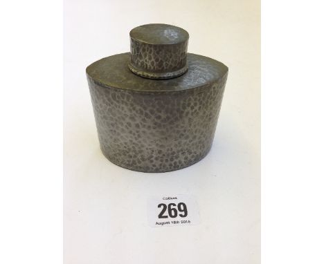 A hammered English pewter for Liberty & Co. elliptical tea caddy.