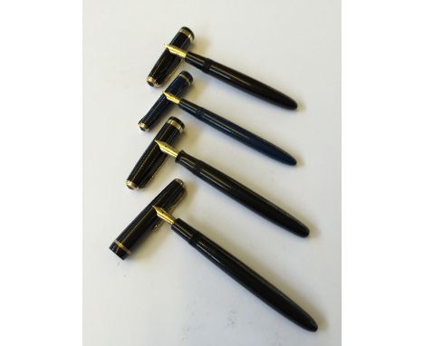 A vintage Parker Senior button filling fountain pen with 14 carat gold nib together with three other Parker fountain pens wit