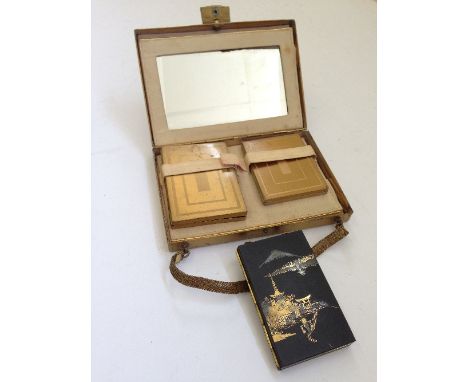 Two novelty ladies' compacts including a small compact decorated with a Japanese scene.
(R35)