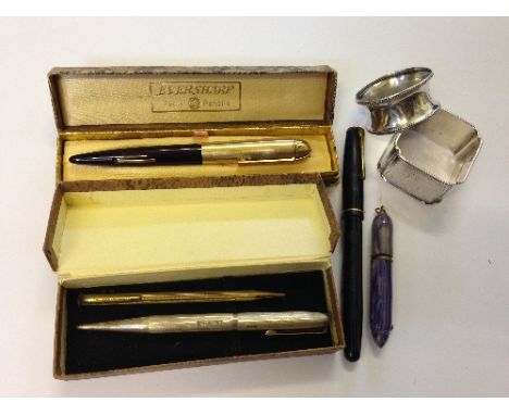 A silver bodied Yard-O-Led propelling pencil together with a small gold coloured pencil, three fountain pens including a blue