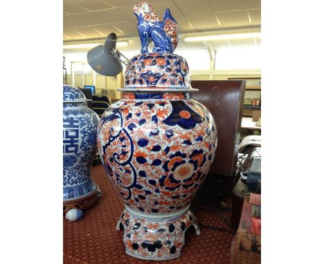 A large early 20th century Imari porcelain ginger jar on stand with Dog of Fo finial (af).