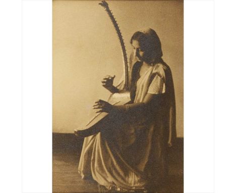? Gloeden, Wilhelm von Portrait of a young woman in a wood in semi-deshabille albumen print, early 20th century, 150 x 110mm.
