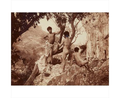 Gloeden, Wilhelm von. Pasqualino with friends on a rocky hillside albumen print, late 19th century, 155 x 205mm.