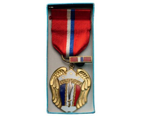 Philippines Liberation Medal, instituted in 1944 Breast Badge, gilt bronze, 42 x 36 mm, partially enameled, original suspensi